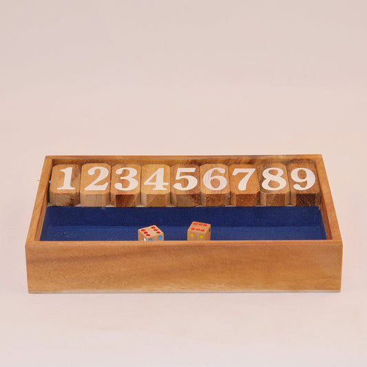 jeu Shut the box en bois avec dés et chiffres à refermer, convivial en famille